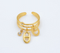 Bague dorée avec breloques dorées