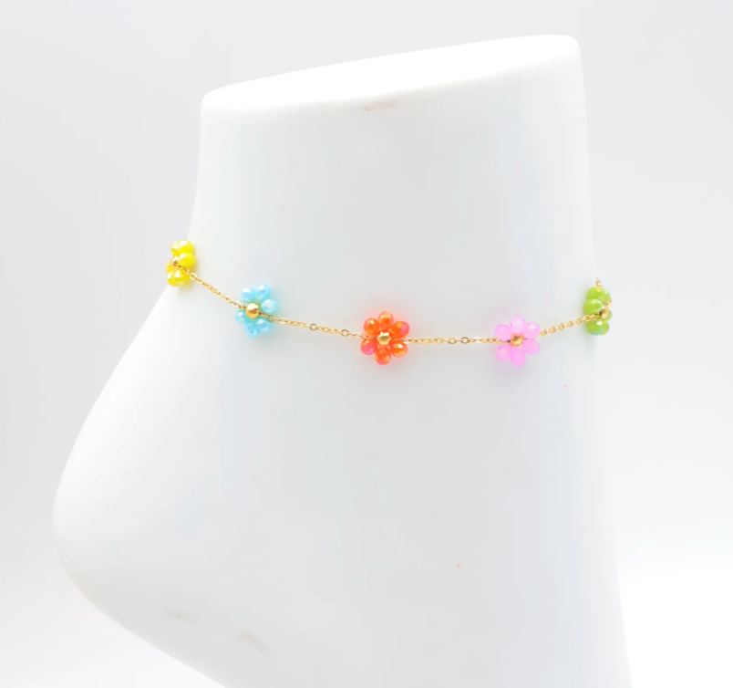 Chaîne de cheville dorée avec fleurs